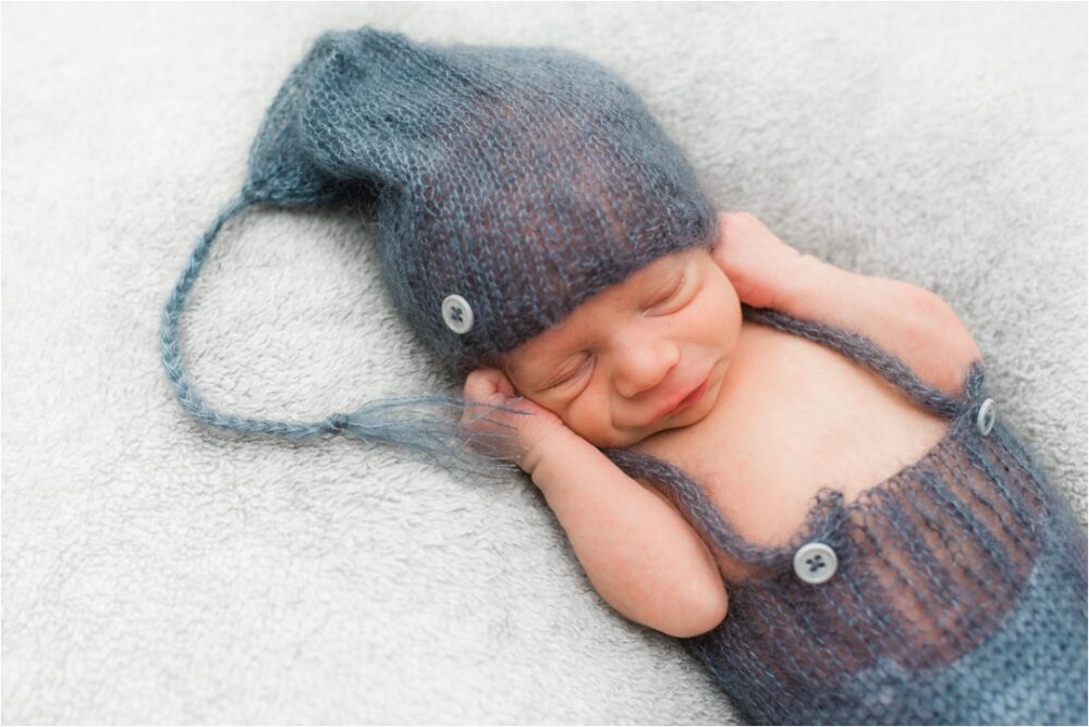 newborn in cute knit clothes